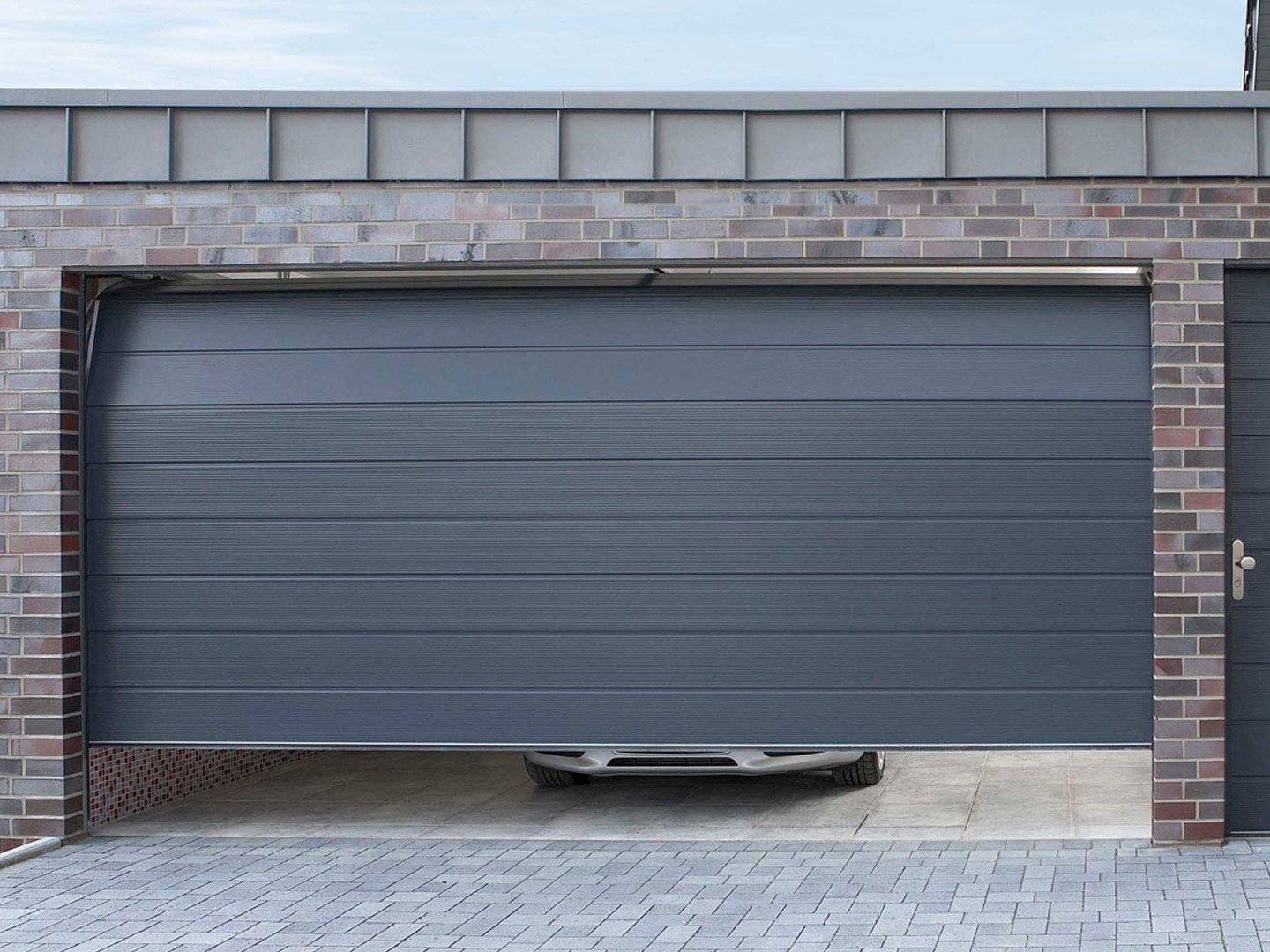 Insulated Roller Garage Doors: Keeping Your Garage Cooler and Quieter