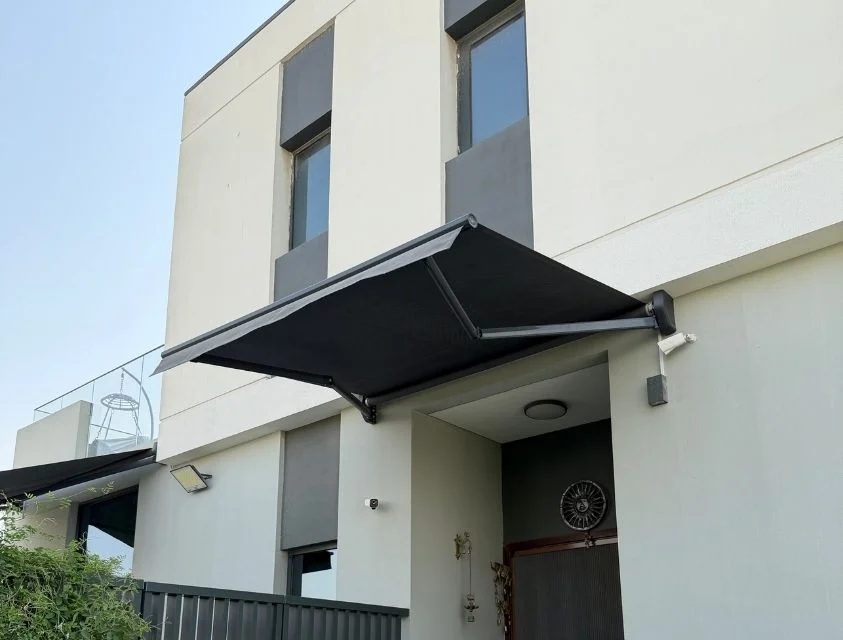 Retractable awning shading a villa terrace